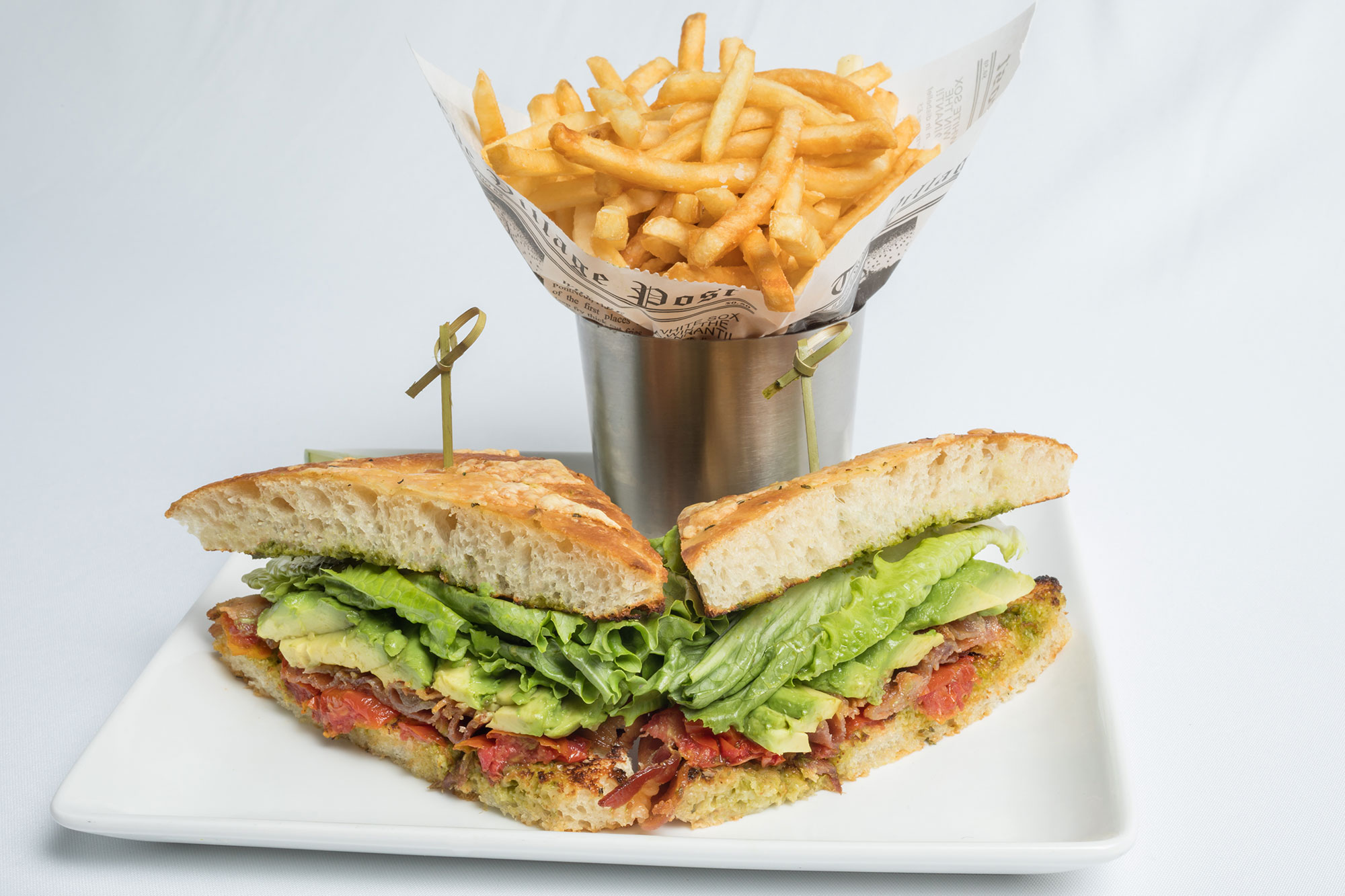 Avocado and bacon sandwich, served with a side of fries, from The Longwood Grille and Bar