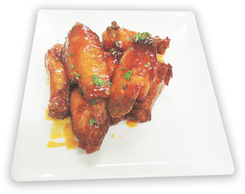 Hot and spicy buffalo chicken wings served on a white plate at The Longwood Grille and Bar